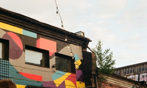 Colorful street mural on classic brick building in Pilsen - apartments in pilsen neighborhood chicago