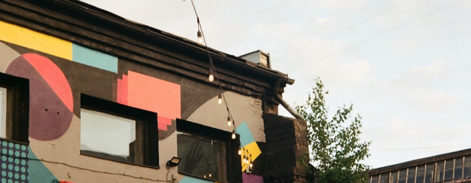 Colorful street mural on classic brick building in Pilsen - apartments in pilsen neighborhood chicago
