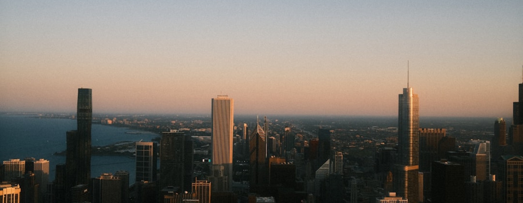 Chicago skyline at dusk from luxury apartment balcony - chicago luxury living
